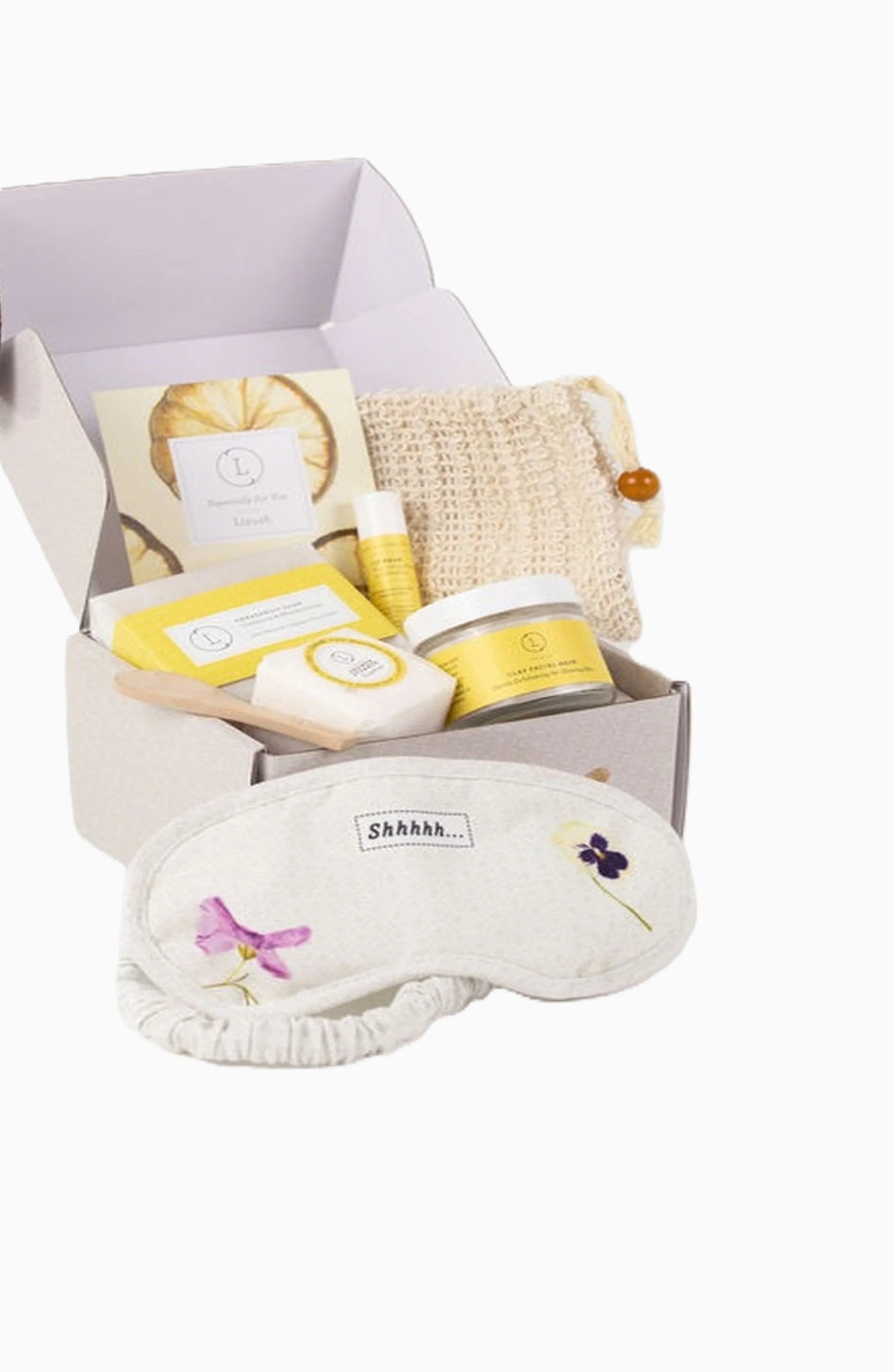 Self-care gift box with sleep mask, body scrub, soap, lip balm, and exfoliating pouch