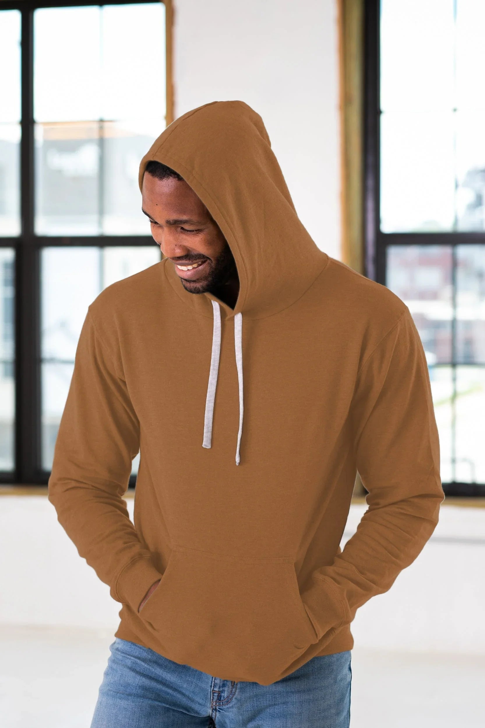 Man wearing camel brown hoodie with white drawstrings, casual winter fashion at Qu!rk Boutique