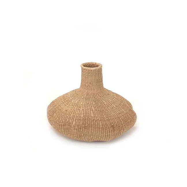Handwoven natural reed vase with wide base, artist-crafted decor from Qu!rk Boutique