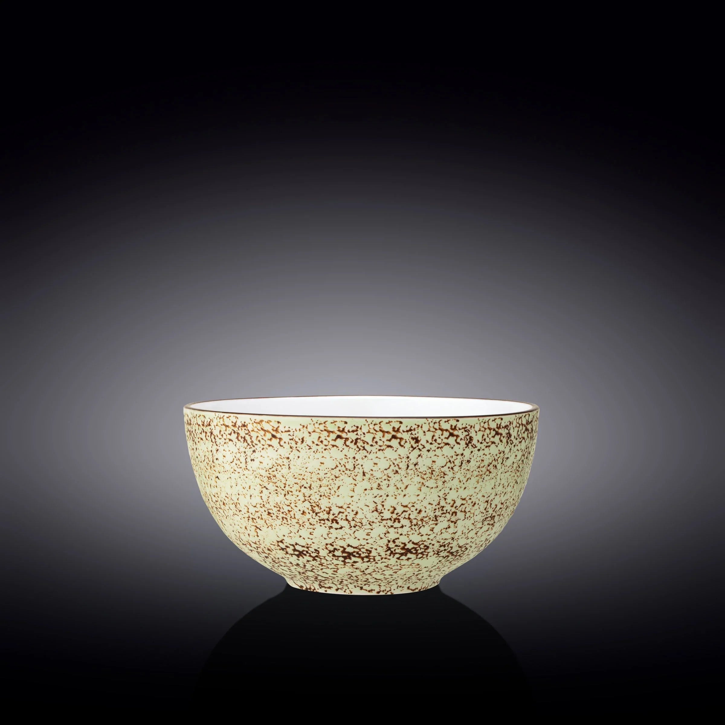 Artist-designed speckled ceramic bowl on dark background, Qu!rk Boutique sustainable gift