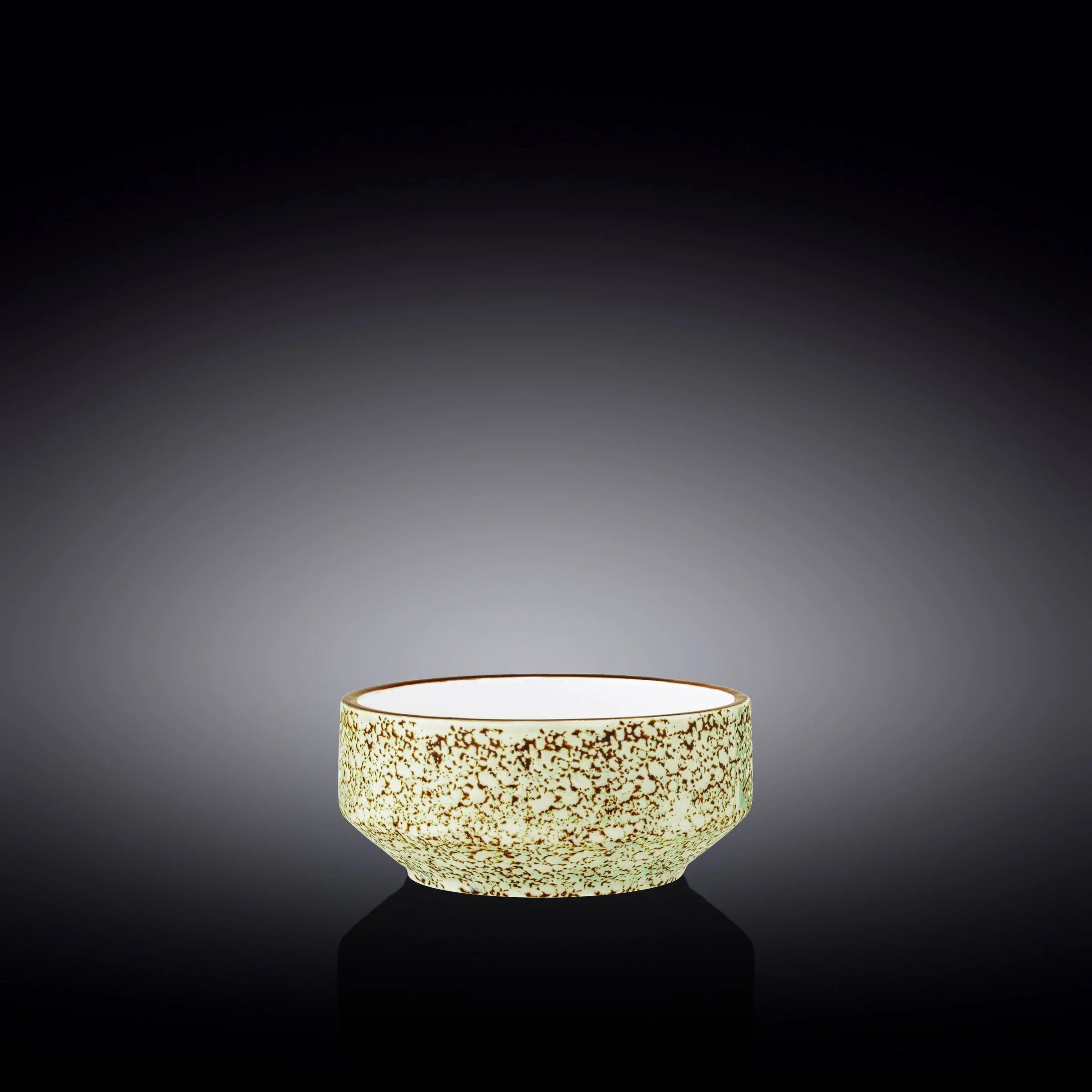 Speckled ceramic bowl on black reflective surface, artist-designed home decor from Qu!rk Boutique