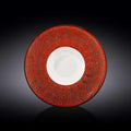 Red artist-designed decorative plate with textured cosmic motif, showcased on dark background