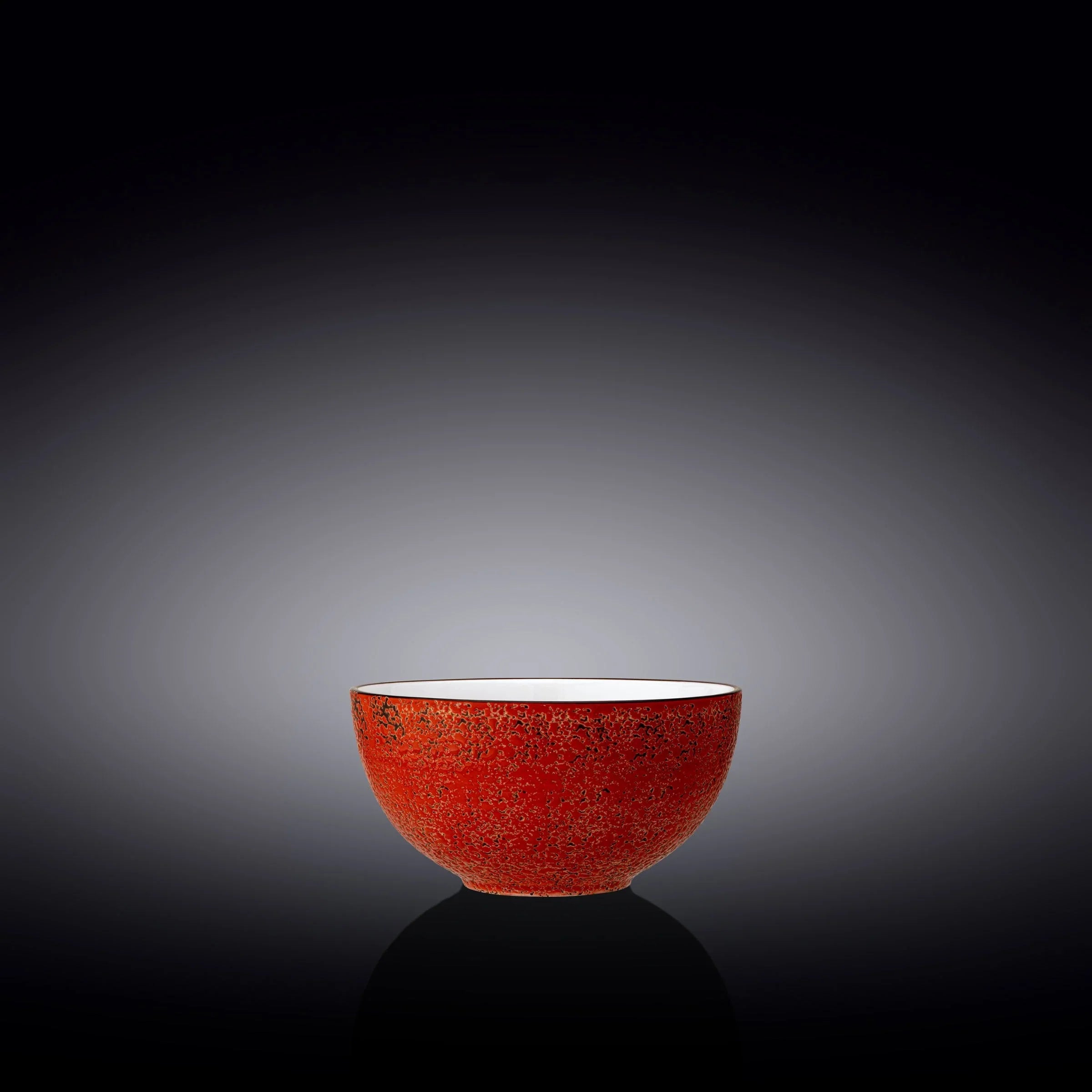 Red textured ceramic bowl with black speckles on black background, Qu!rk Boutique artisan gift