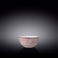 Pink speckled ceramic bowl on black reflective background, artist-designed home decor