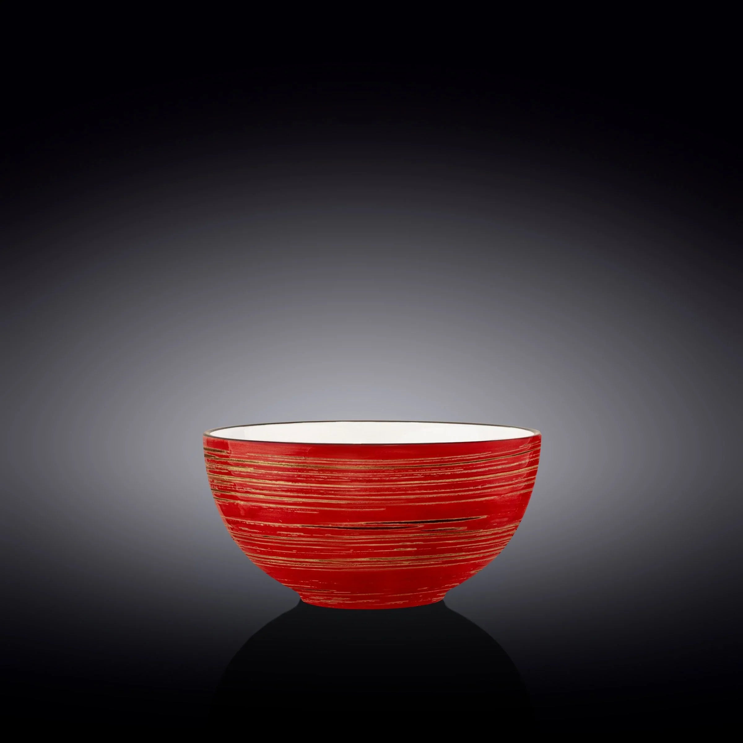 Red artisan bowl with gold lines on black background at Qu!rk Boutique & Gift Shop