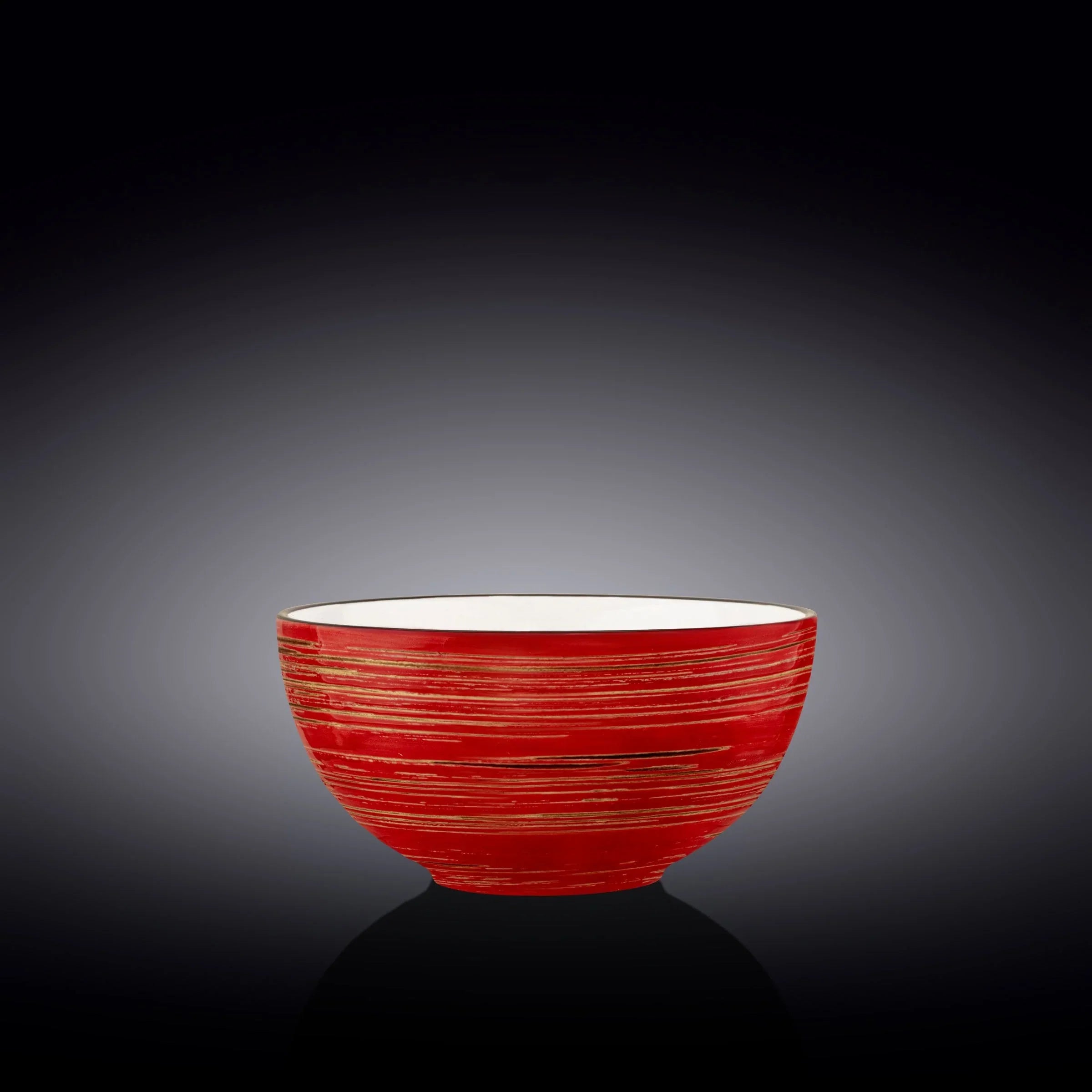 Red artisan bowl with gold stripe accents on a dark gradient background, Qu!rk Boutique