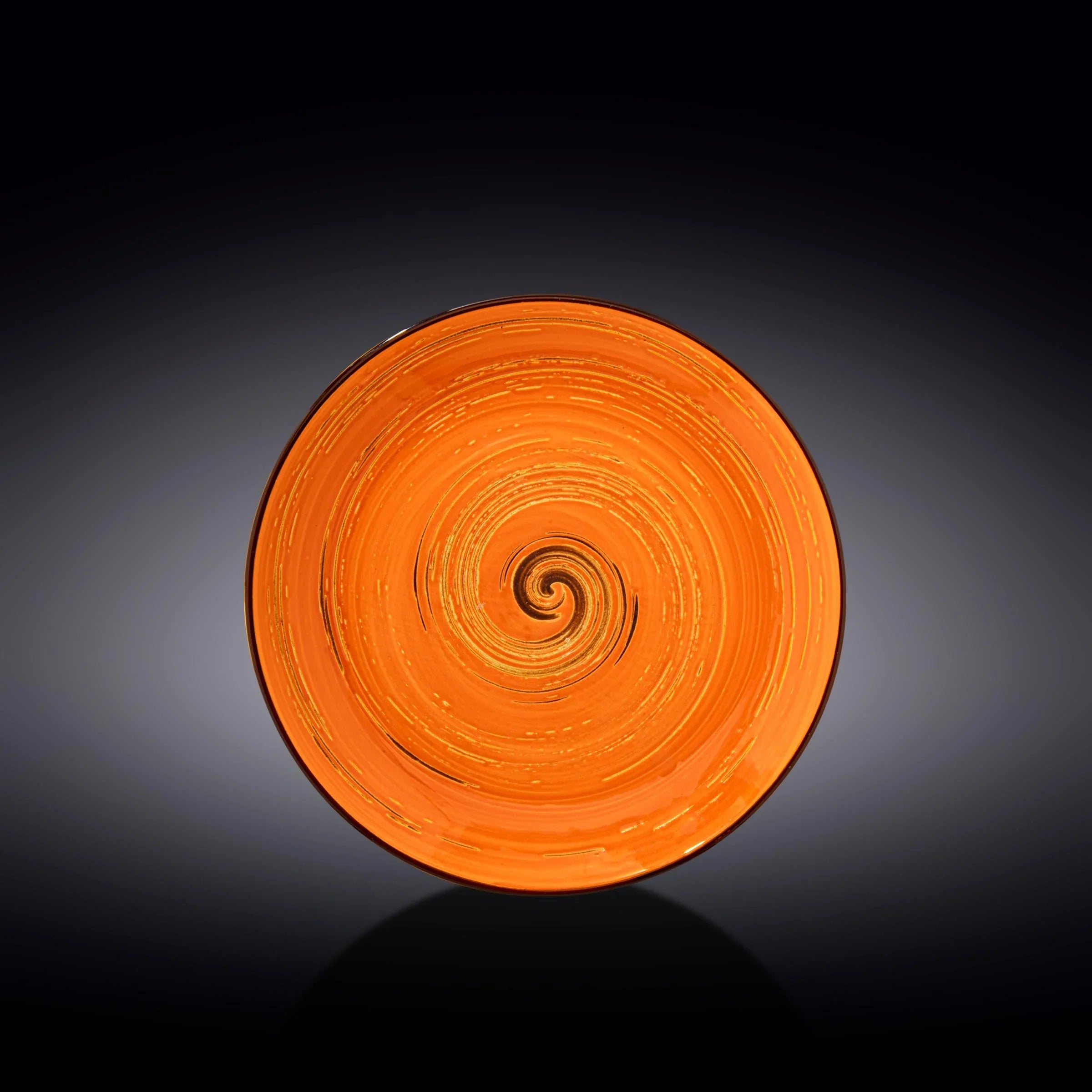 Artist-designed orange spiral glass plate on black background, Qu!rk Boutique gift shop