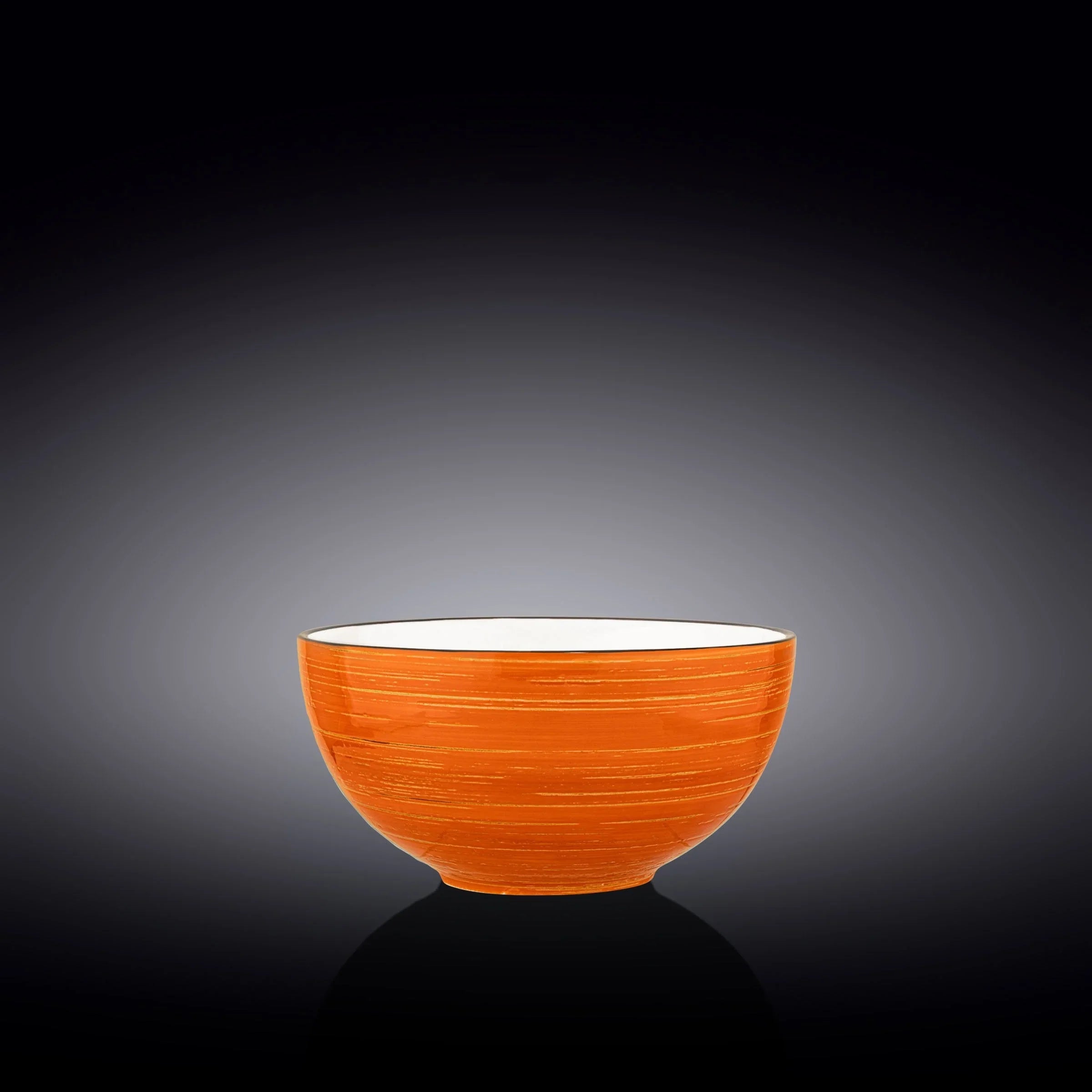 Artist-designed orange ceramic bowl with white interior on dark background, Qu!rk Boutique