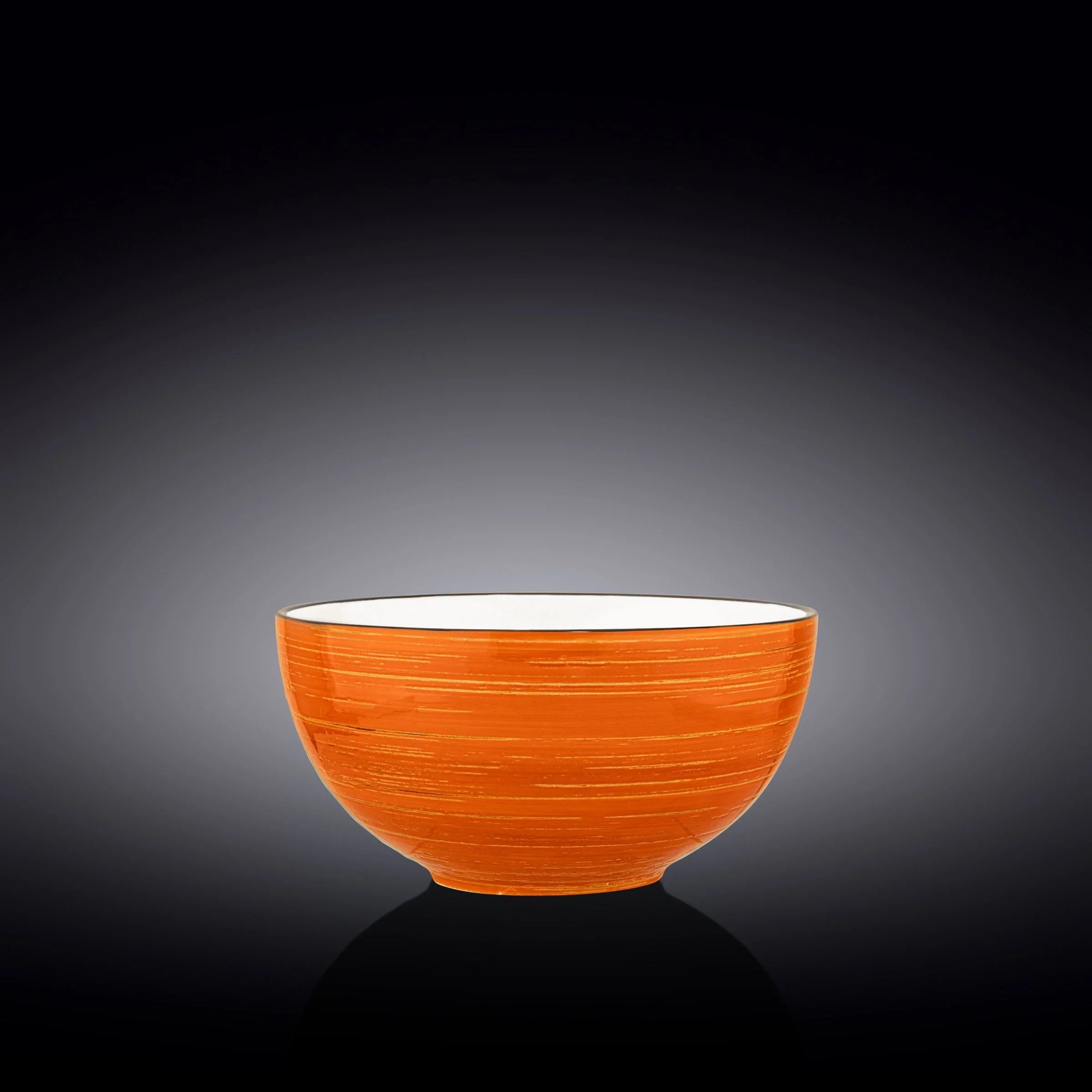 Handcrafted orange ceramic bowl with white interior on black gradient background, Qu!rk Boutique