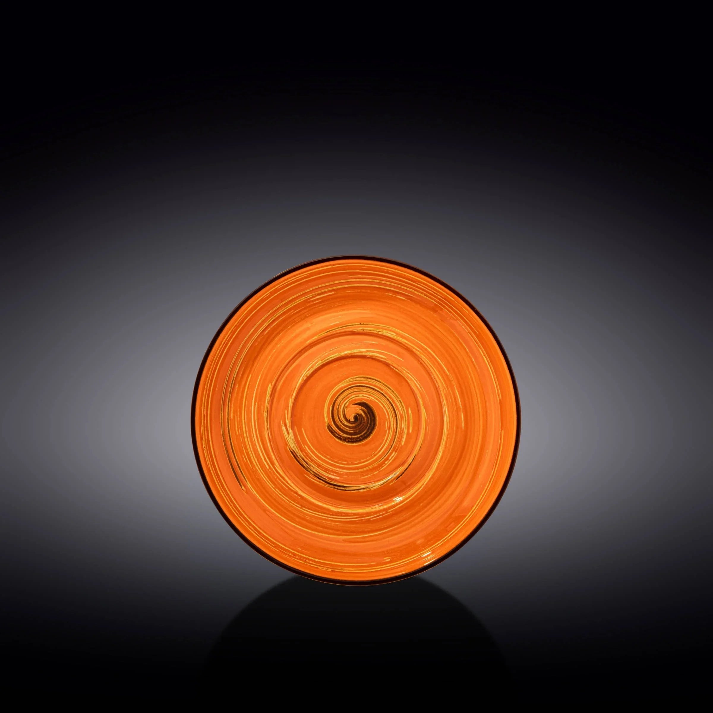 Artist-designed orange spiral glass plate on black background, Qu!rk Boutique decor