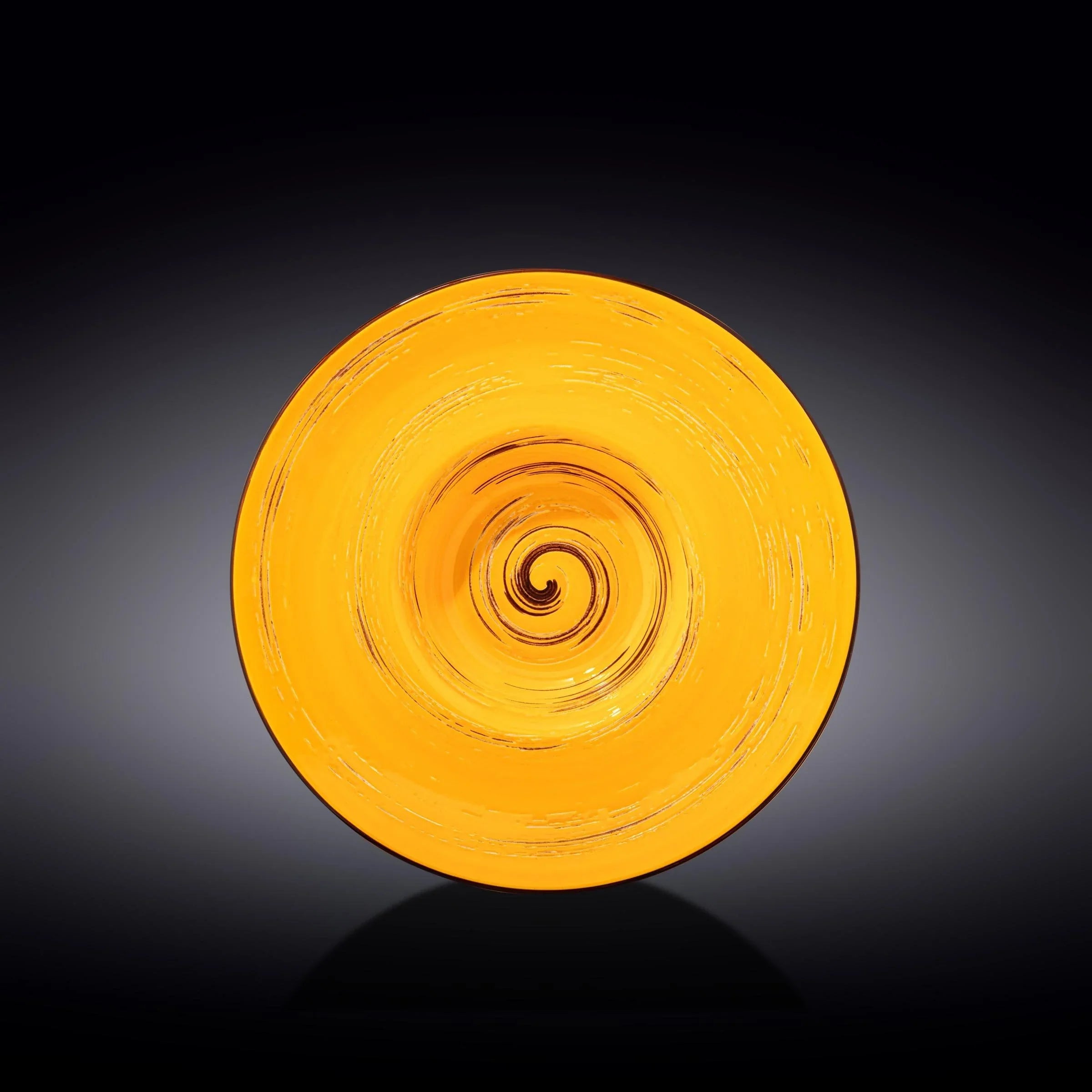 Artist-designed yellow glass swirl plate on black background from Qu!rk Boutique