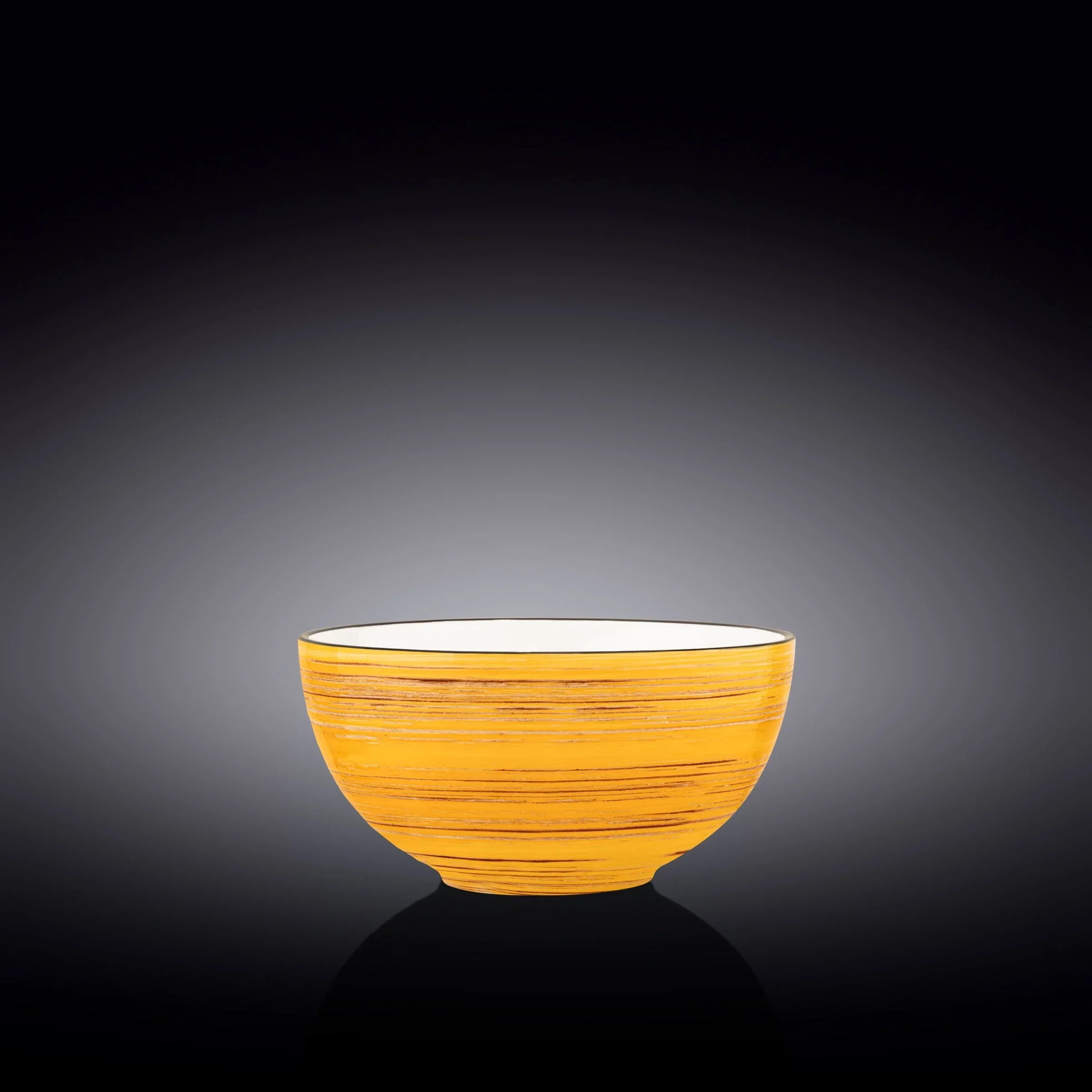 Handcrafted yellow ceramic bowl with textured pattern on black background, Qu!rk Boutique gift
