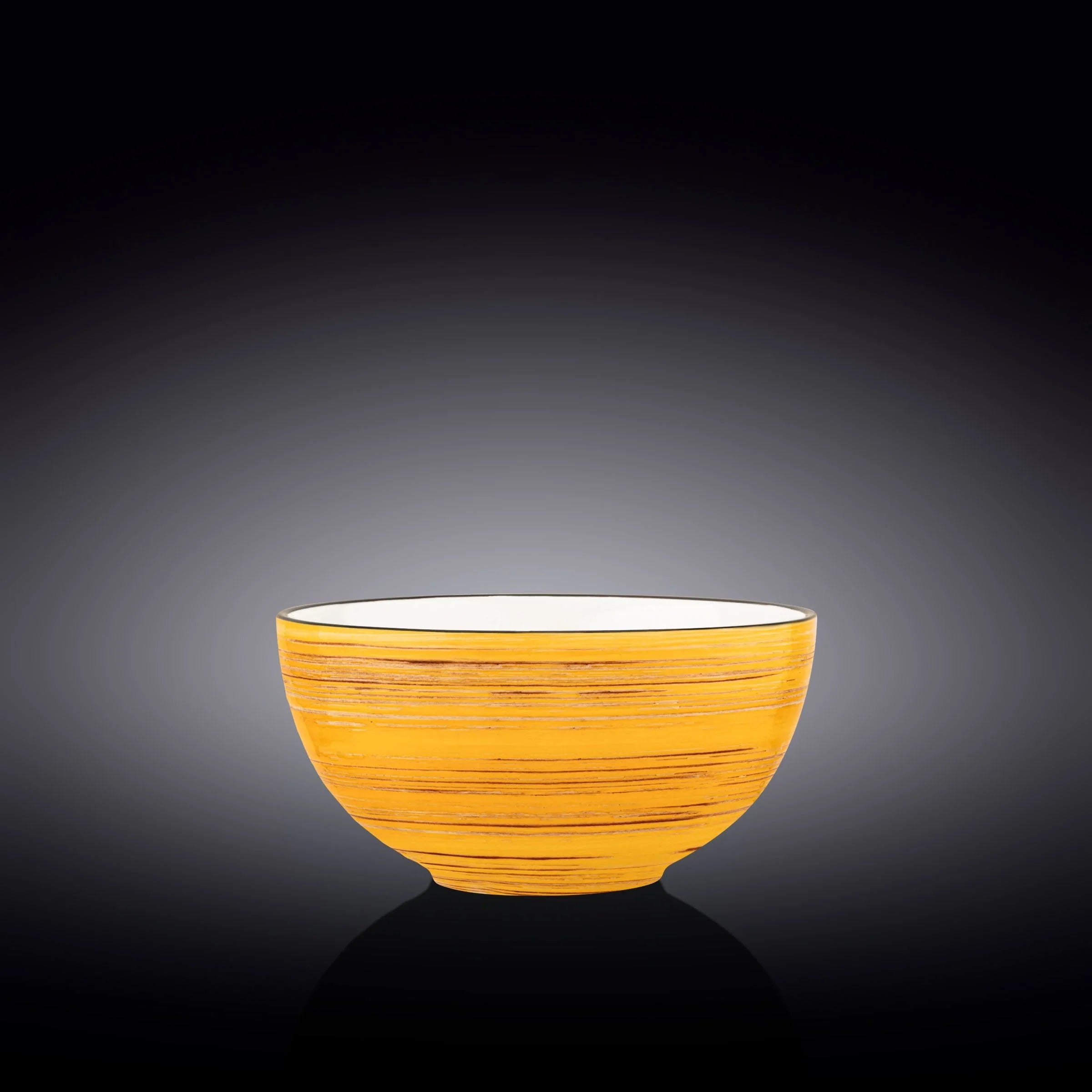 Handcrafted yellow ceramic bowl with brushed texture on black background, Qu!rk Boutique