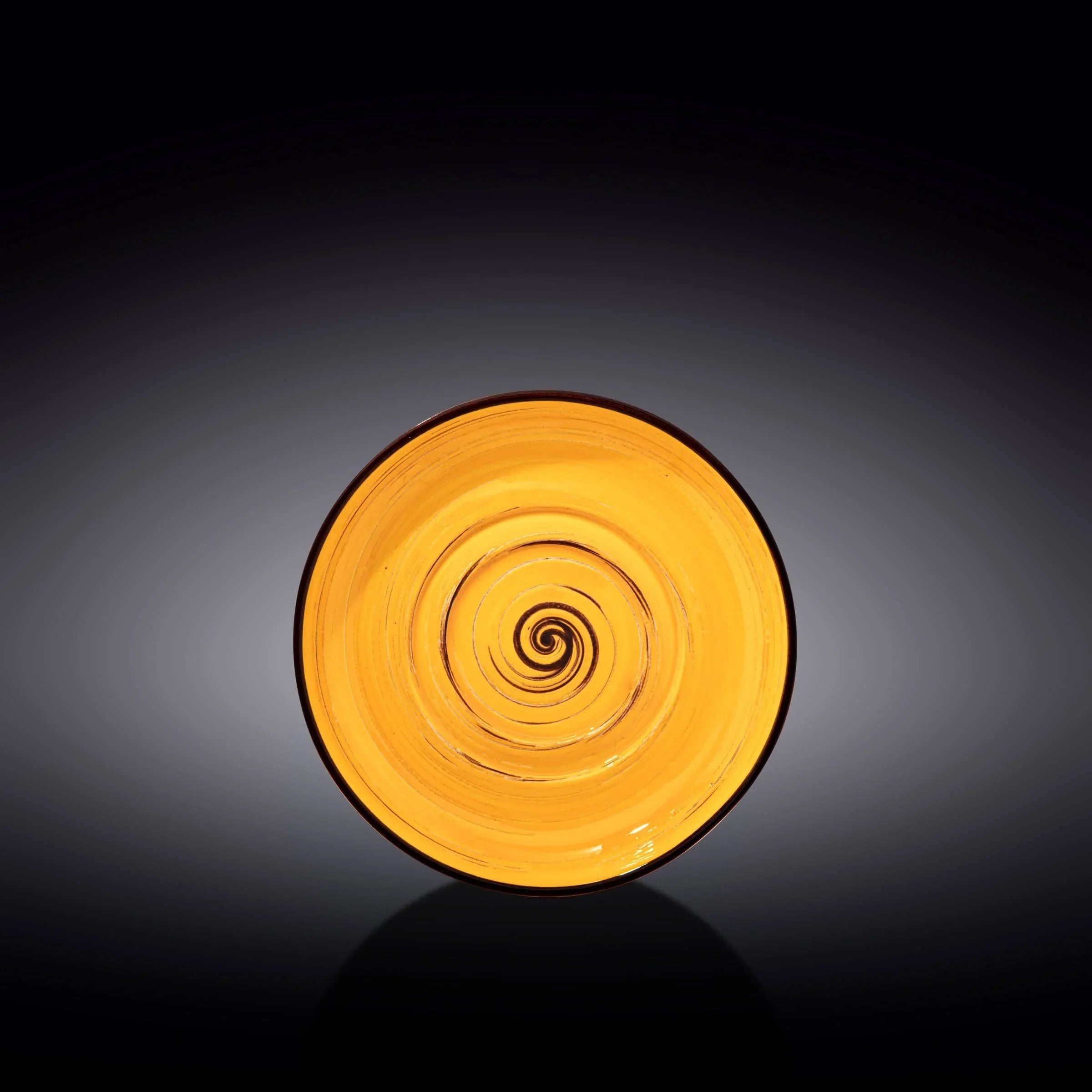 Yellow spiral ceramic plate on a dark background, artist-designed gift from Qu!rk Boutique