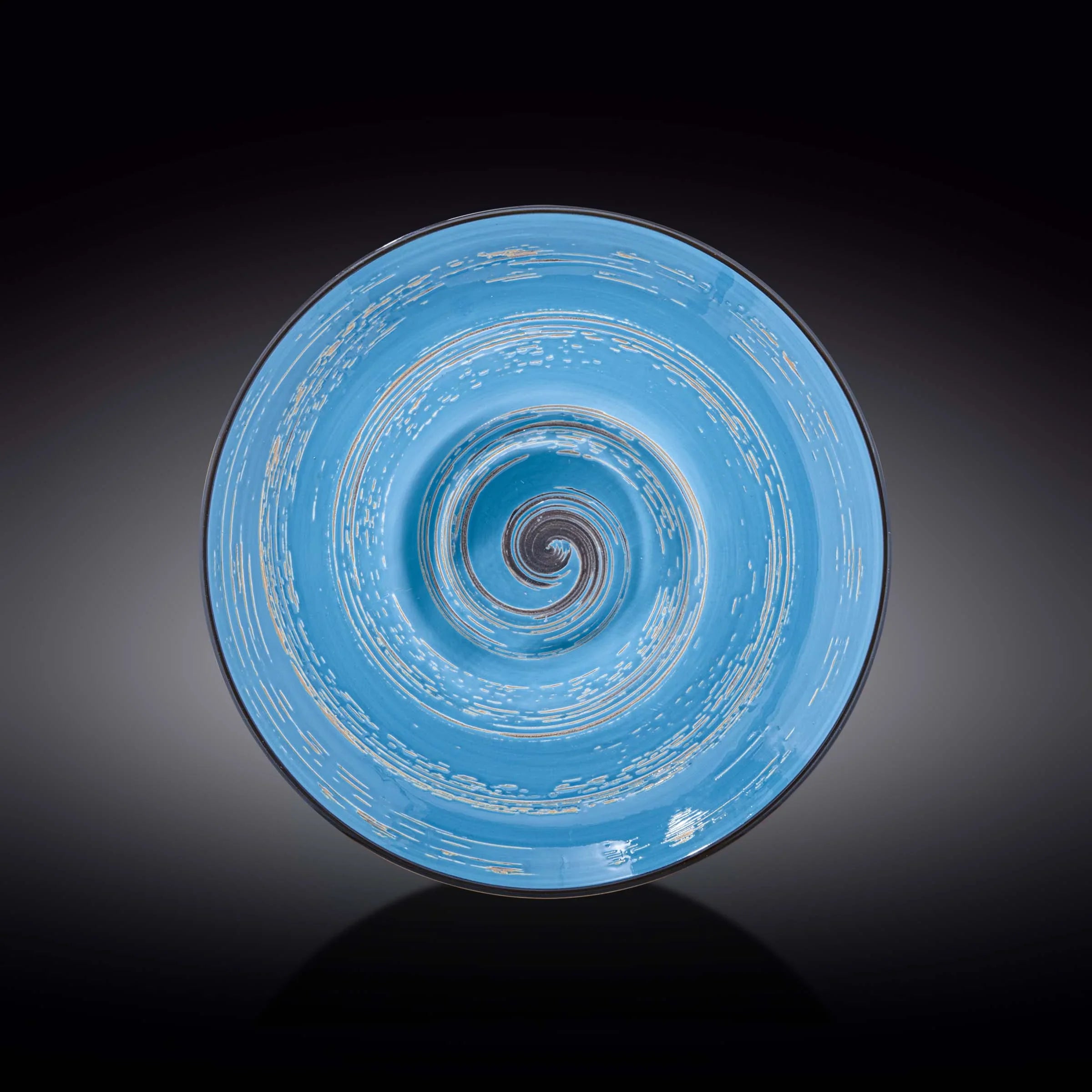 Artist-designed blue spiral ceramic bowl on dark background, Qu!rk Boutique giftware