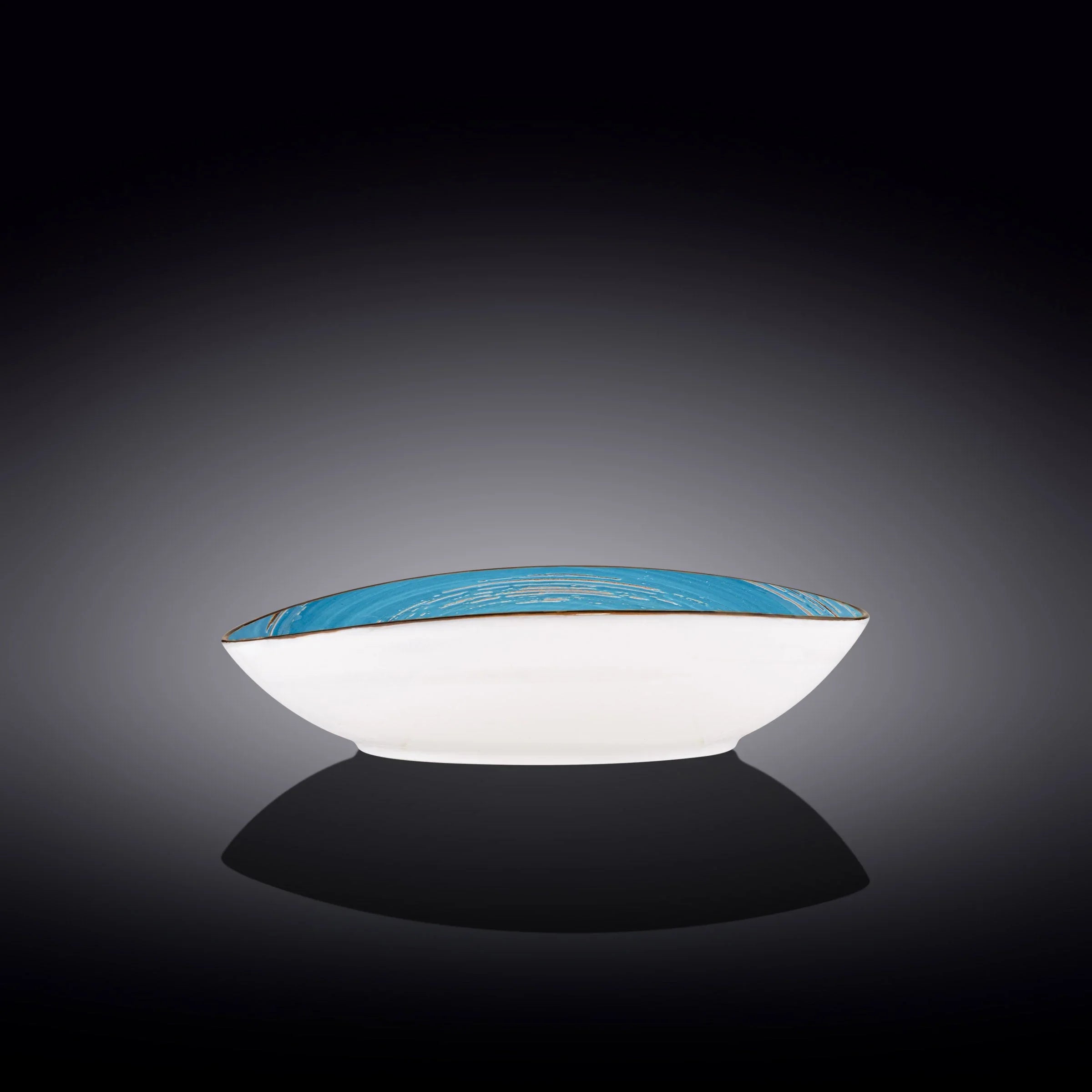 Artist-designed blue and white ceramic bowl on black gradient background, Qu!rk Boutique gift