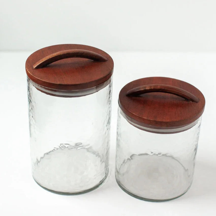 Two clear glass jars with dark wood lids from Qu!rk Boutique, minimalist kitchen storage