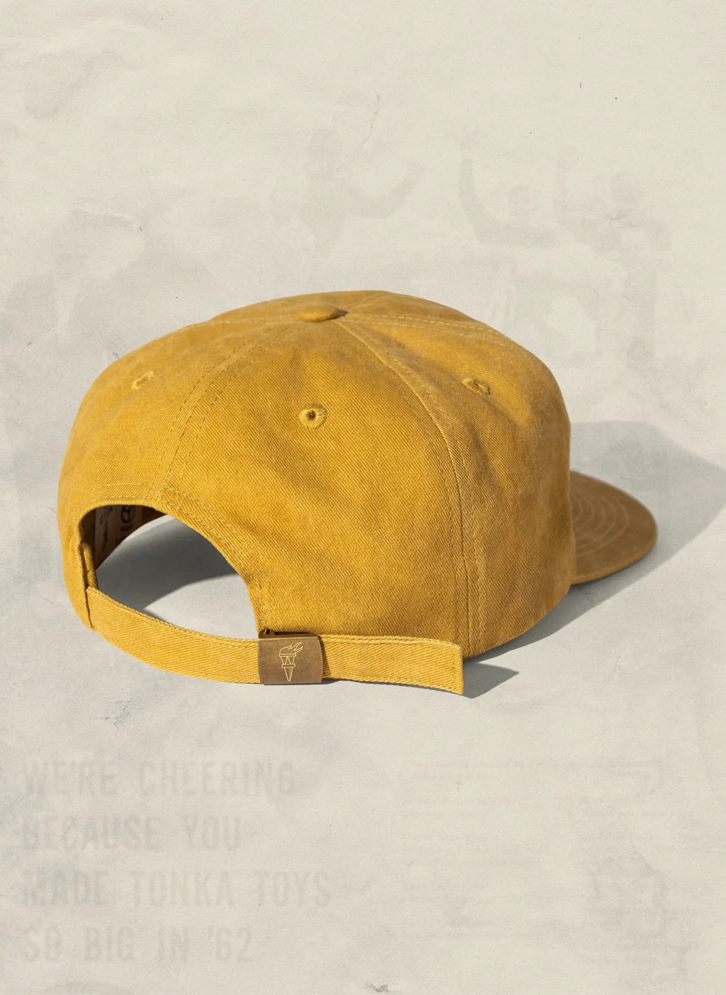 Mustard yellow cotton cap with adjustable strap, artist-designed at Qu!rk Boutique