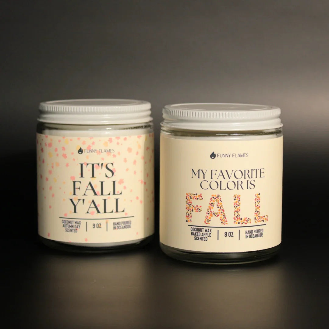 Two 9 oz Funny Flames scented coconut wax candles with fall-themed labels and white lids