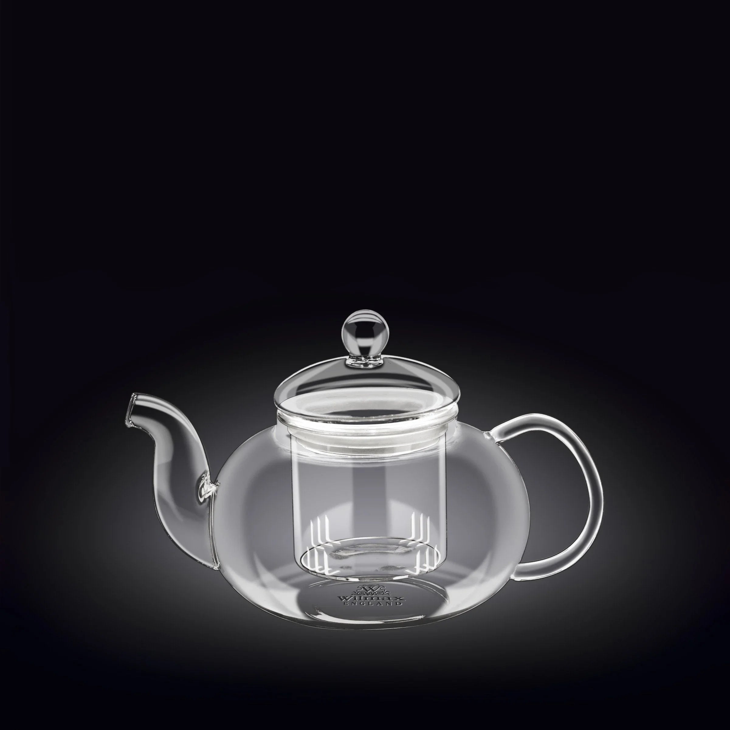 Clear glass teapot with infuser on black background, stylish gift from Qu!rk Boutique