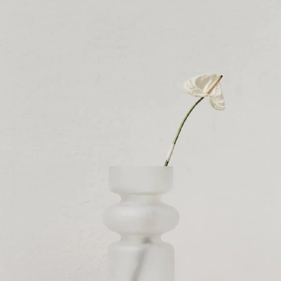 Minimalist white vase with a single white flower, modern decor from Qu!rk Boutique