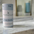 MamaSuds Toilet Bombs eco-friendly cleaning tabs on a marble bathroom counter at Qu!rk Boutique