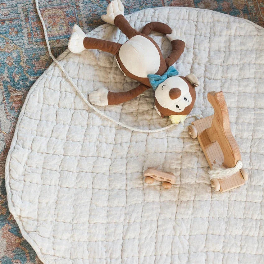 Plush monkey toy and wooden pull toy on quilted play mat, Qu!rk Boutique kids gift idea