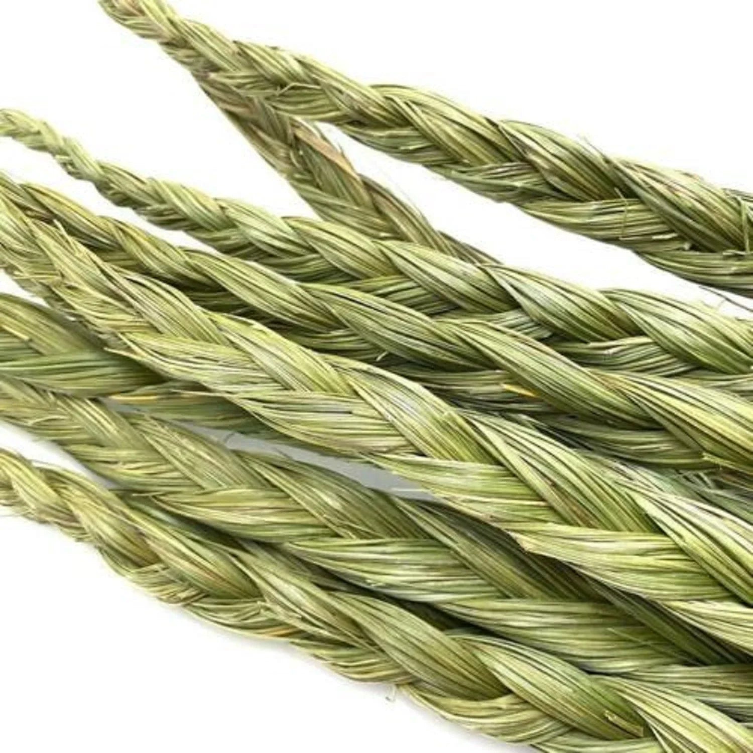 Eco-friendly braided sweetgrass smudge sticks on white background, Qu!rk Boutique gift shop