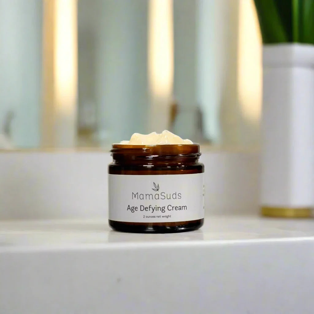 MamaSuds Age Defying Cream jar on bathroom counter, skincare product at Qu!rk Boutique