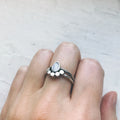 Silver teardrop gemstone ring with dotted accents on hand, Qu!rk Boutique jewelry