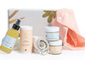 Organic baby care set with calming baby oil, baby powder, magic balm, diaper balm, and soft cloths