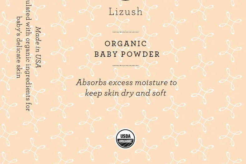 Lizush organic baby powder label with USDA organic logo on peach patterned background