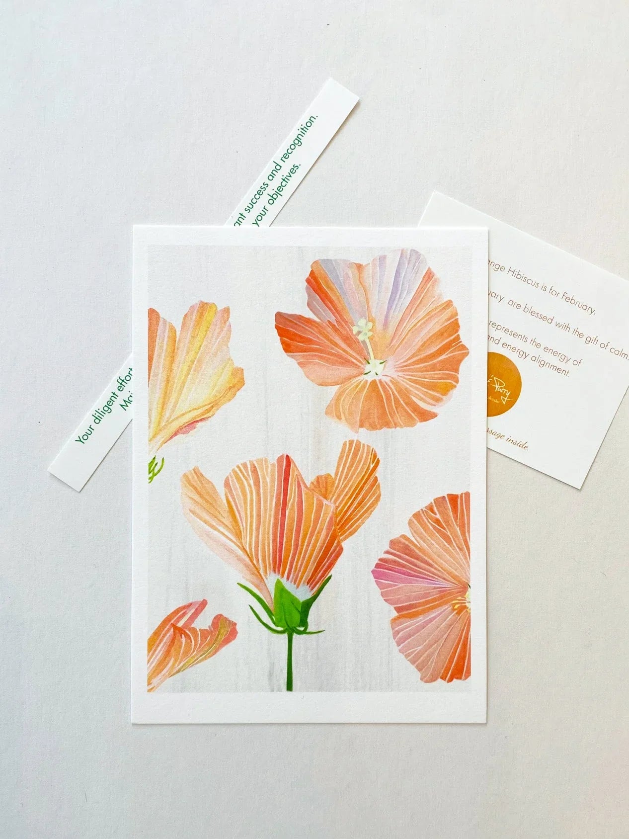 Art print of orange hibiscus flowers on white background with inspirational fortune and info card