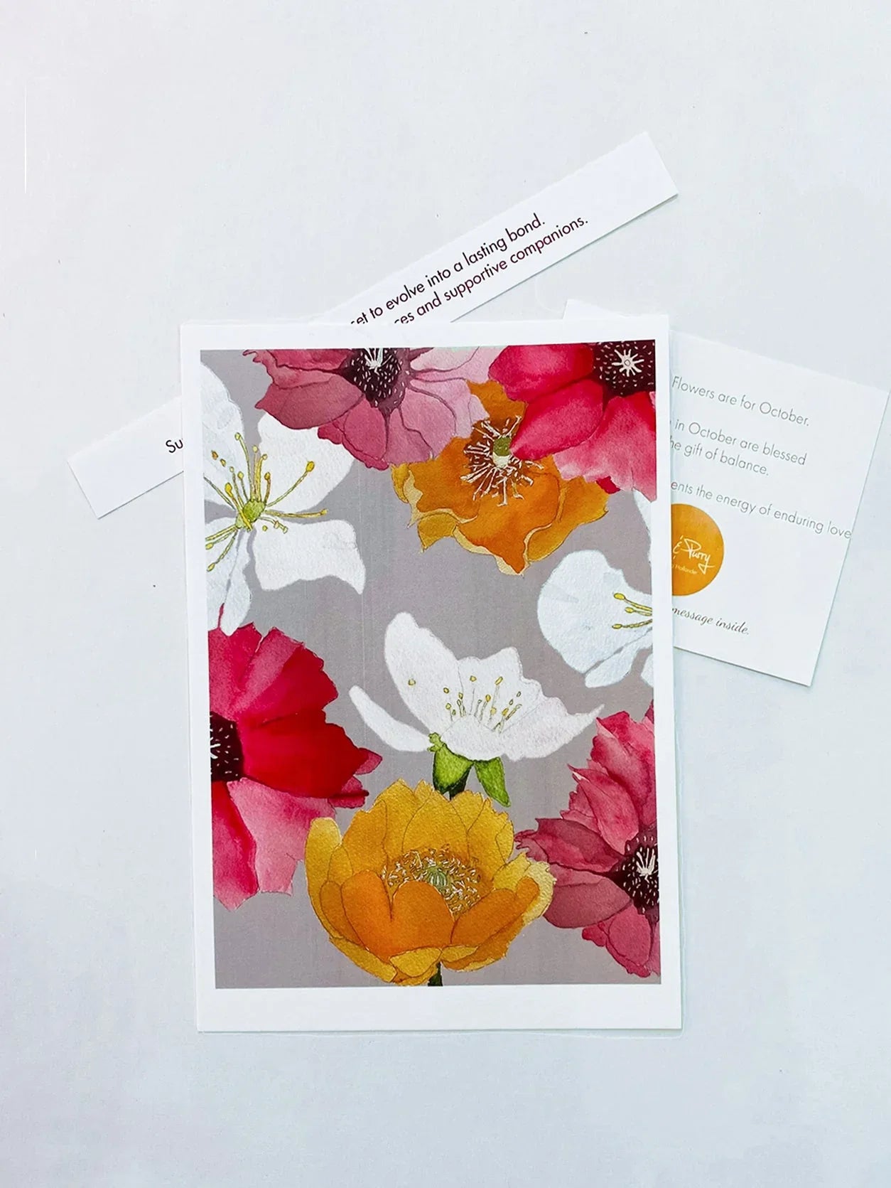 Colorful floral art print featuring pink, orange, red, and white cactus flowers on gray background