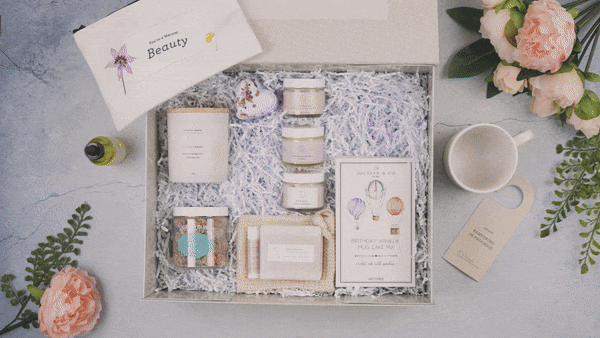 Birthday gift box with candle, bath products, mug, and flowers, Qu!rk Boutique style