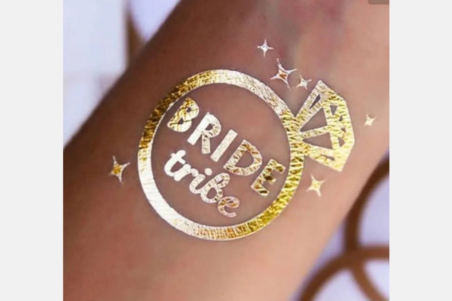 Gold metallic 'Bride tribe' ring tattoo on skin, fun bridal party accessory from Qu!rk Boutique