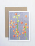 Brunia floral notecard with orange and green berries illustration on gray background and kraft envelope