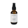 Slow North Calm rose water facial toner in amber spray bottle with white label