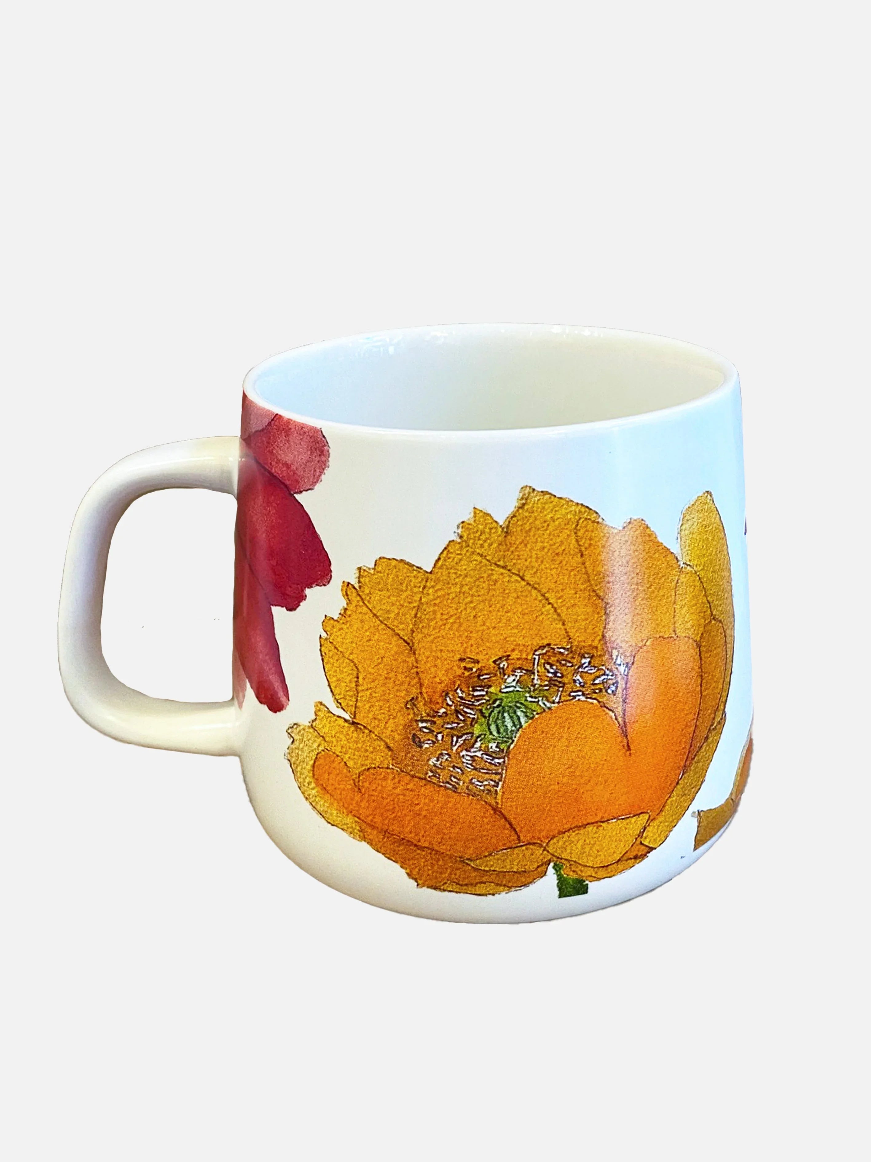White ceramic mug with large orange and red cactus flower prints, side view