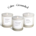 Three lit soy candles labeled Lavender + Cedar, Eucalyptus + Lavender, Forest Bathing in frosted glass jars