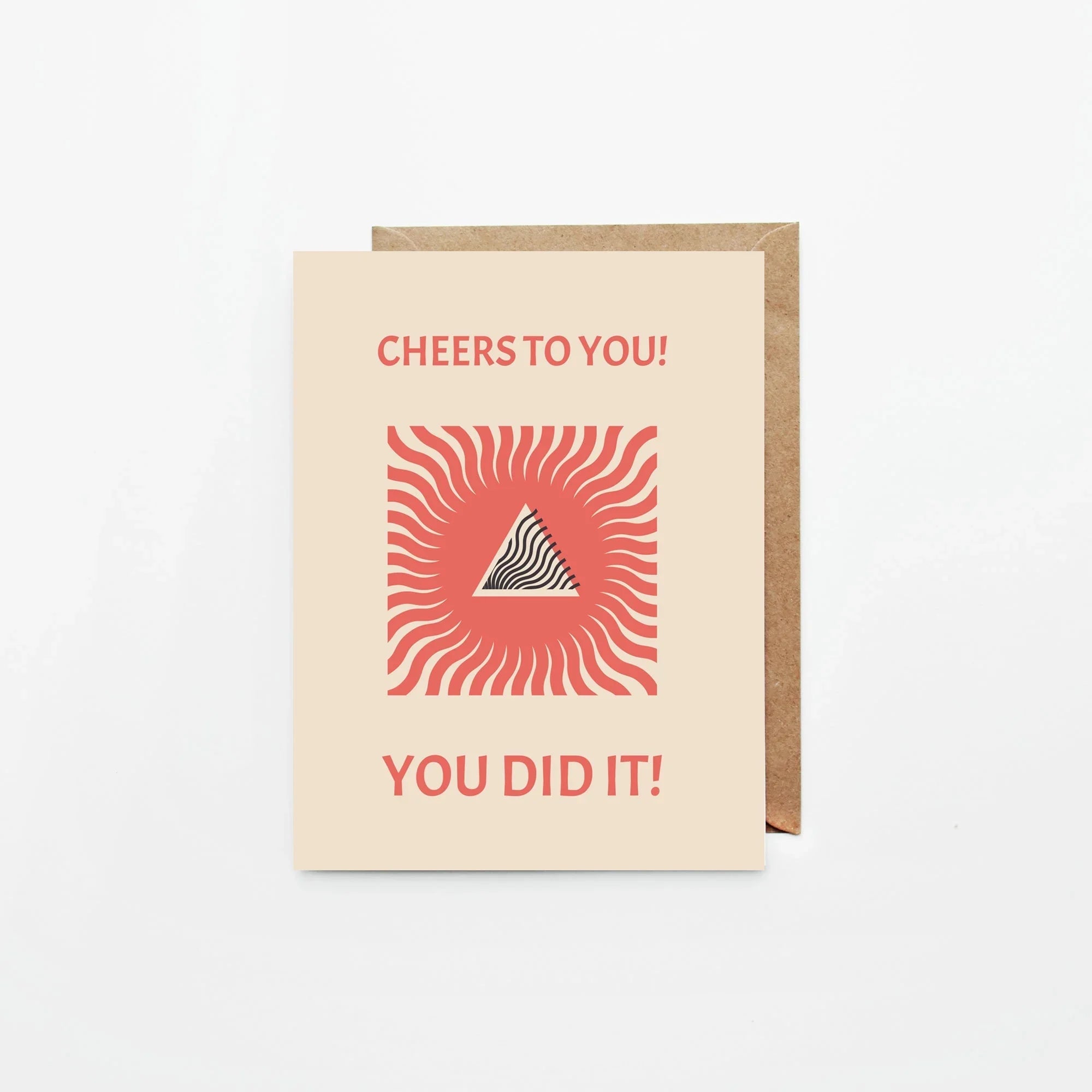 Beige congratulatory card with red sunburst design and text Cheers to You! You Did It!
