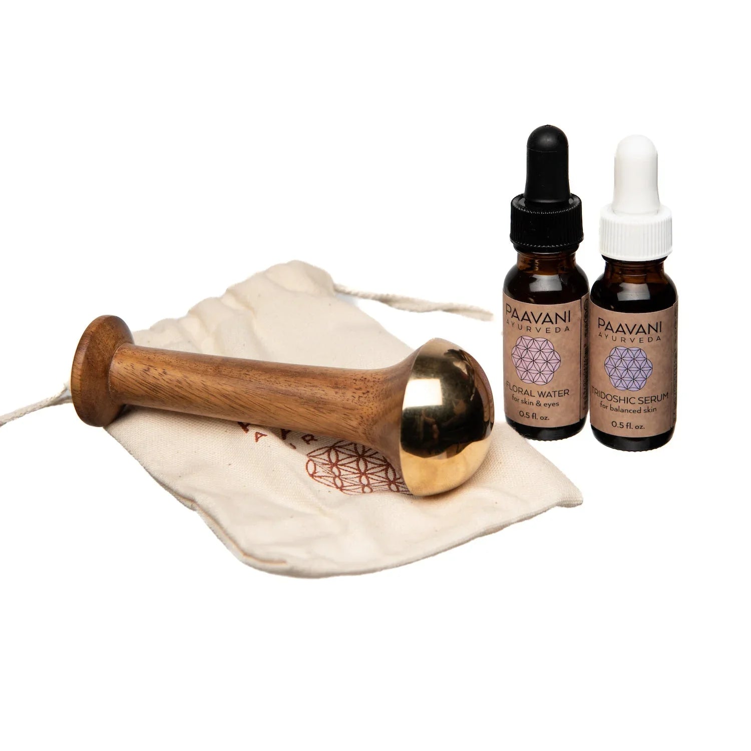 Ayurveda facial kit with wooden massage tool, herbal serums, and canvas bag from Qu!rk Boutique