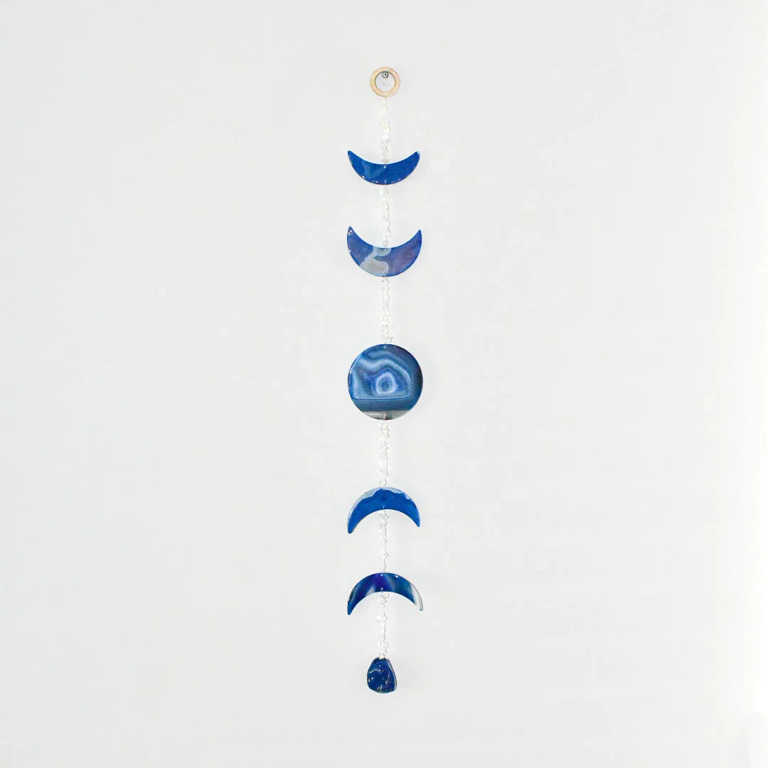 Blue agate moon phase wall hanging on white background, Qu!rk Boutique cosmic home decor gift