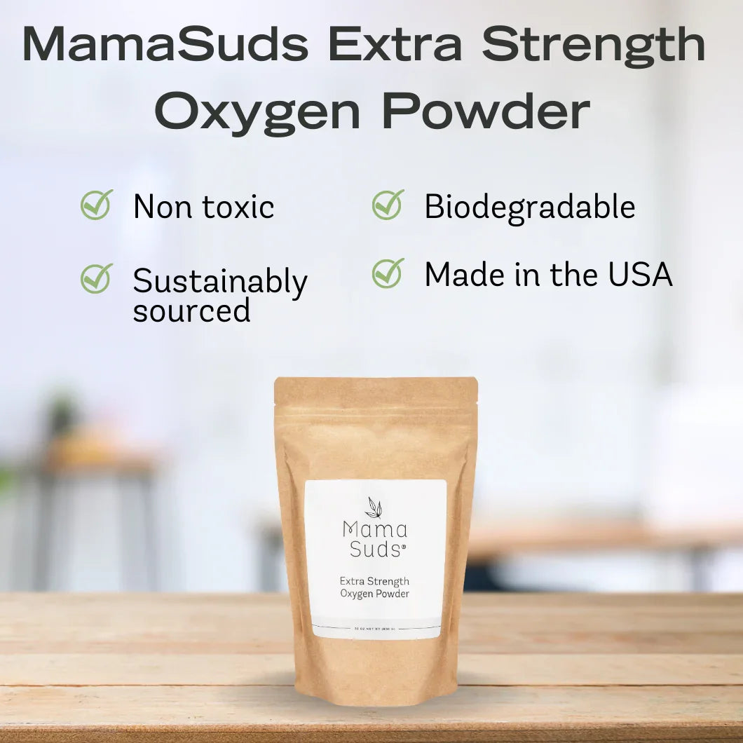 MamaSuds Extra Strength Oxygen Powder eco-friendly biodegradable pouch on wooden table, non-toxic, sustainably sourced, made in USA