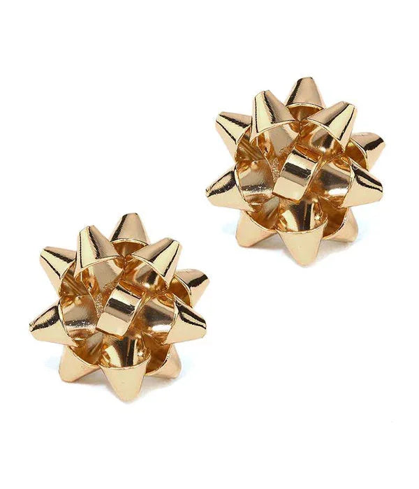 Two shiny gold star-shaped metal puzzle pieces on white background