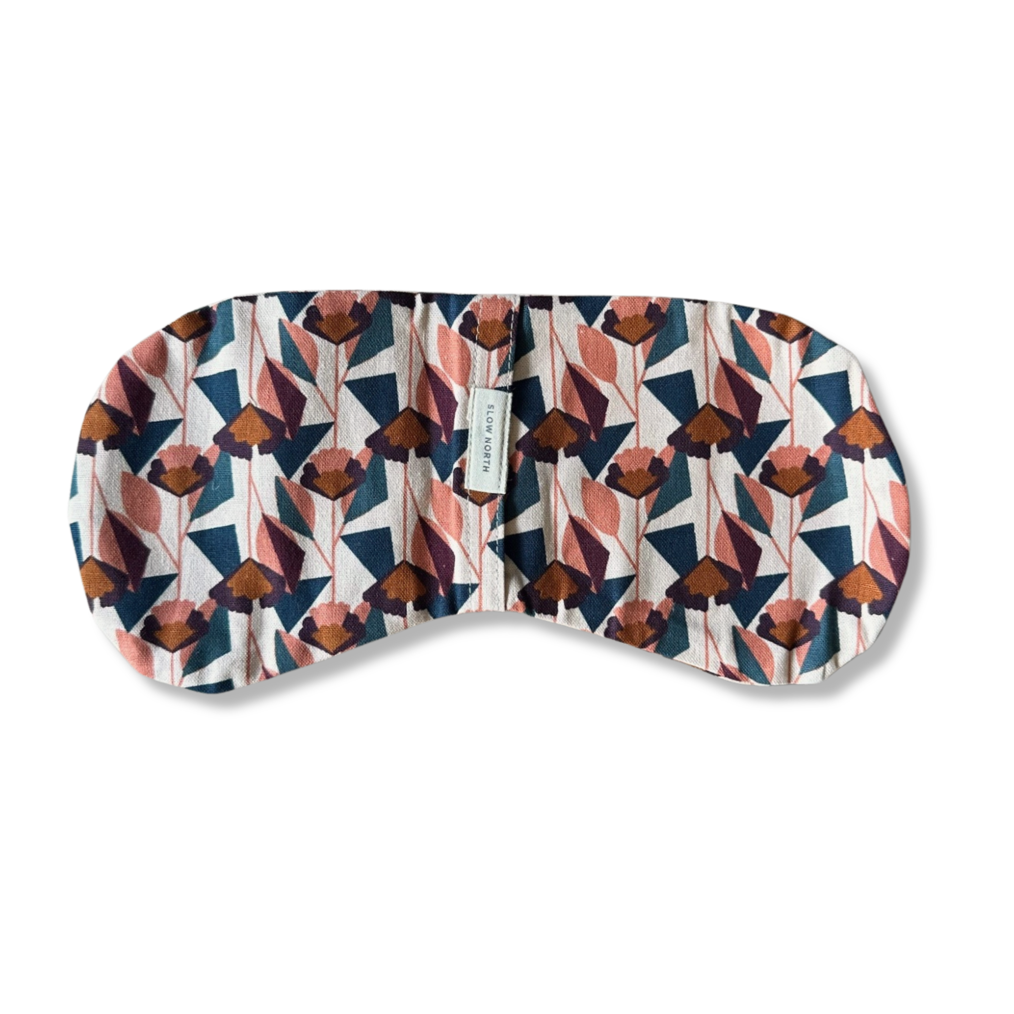 Floral patterned eye mask with pink, blue, and brown geometric flowers and Slow North label