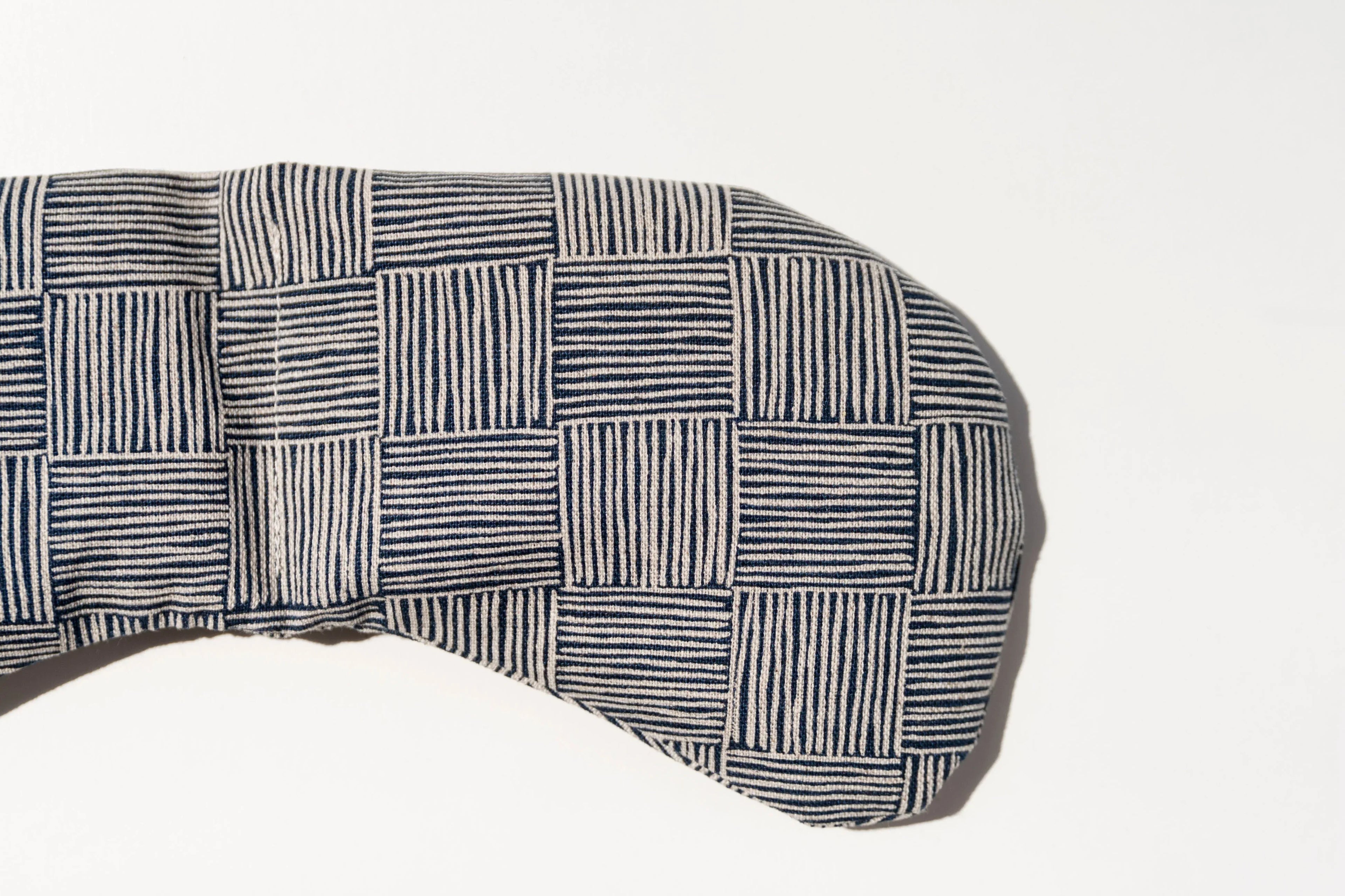 Striped square pattern fabric eye mask on white background, Qu!rk Boutique gift accessory