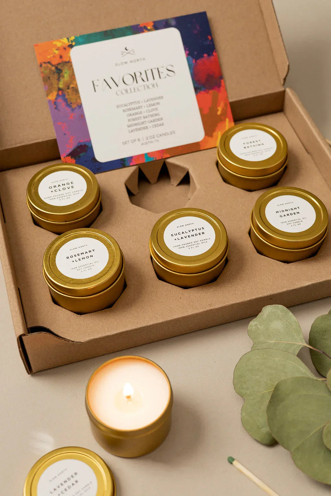 Slow North Favorites Collection set of six scented soy candles in gold tins with eucalyptus, lavender, and cedar scents