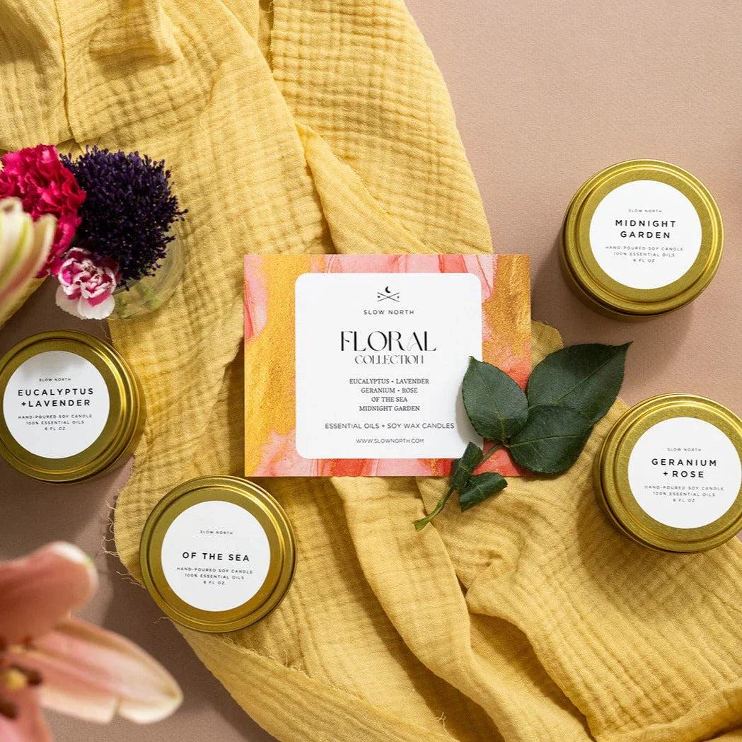 Floral collection soy candles with gold lids, yellow fabric, and fresh flowers, Qu!rk Boutique