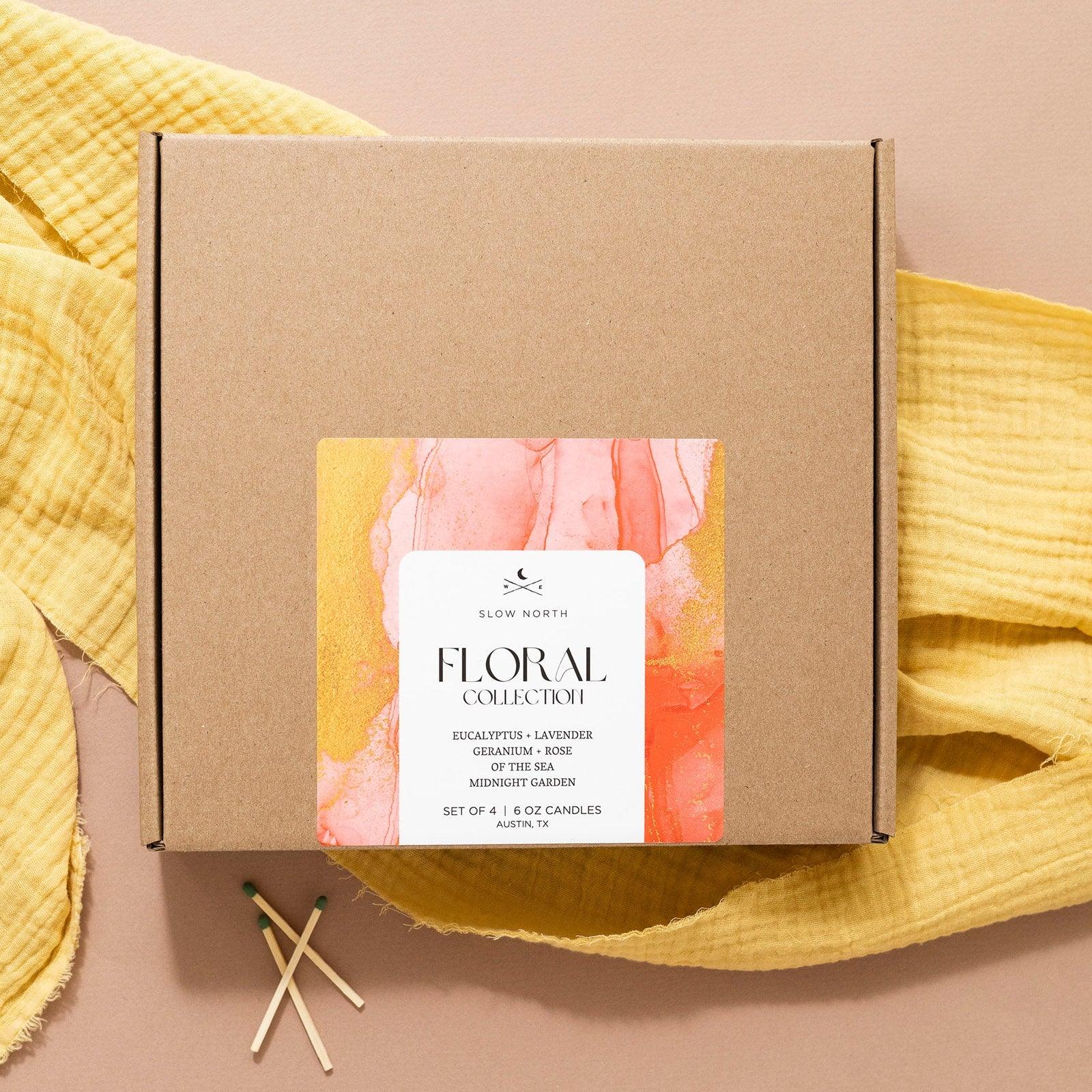 Slow North Floral Collection candle gift box with marbled label, yellow cloth, and matches